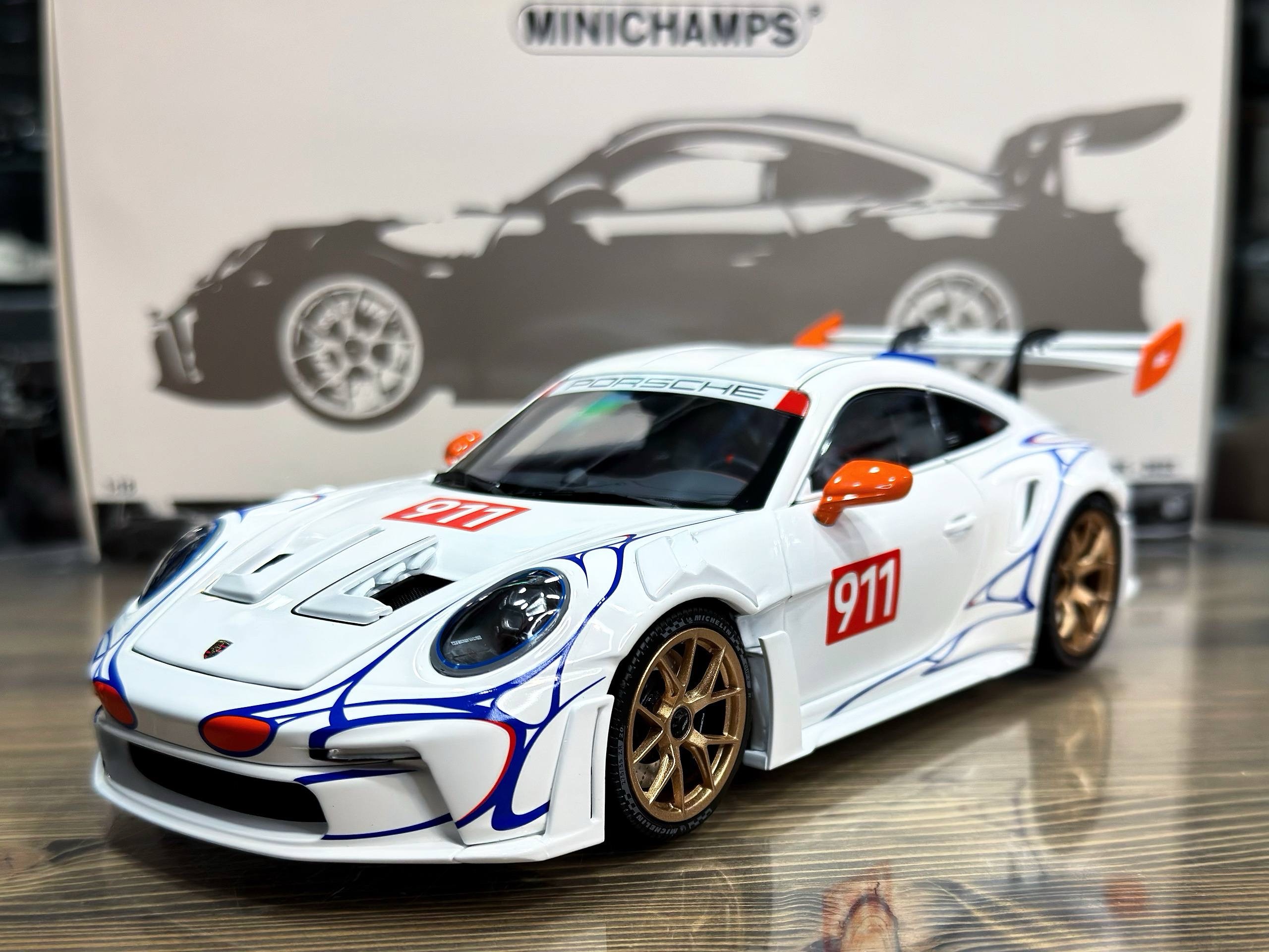 110062041 Minichamps Porsche 911 (992) GT3RS 2023 White/Orange Decor 1:18